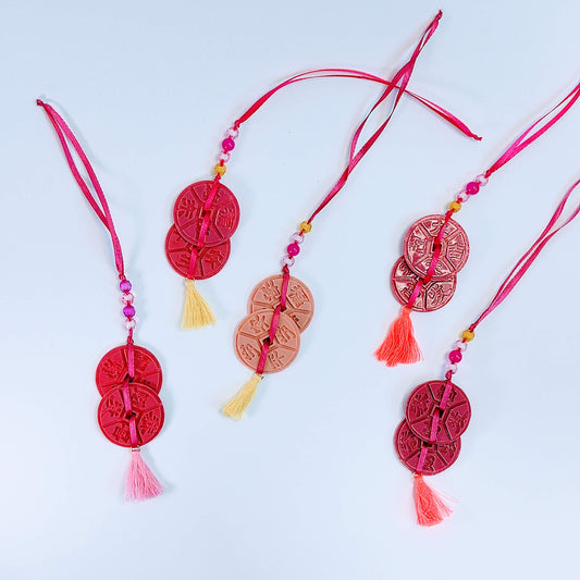 Moneda China Colgante (unidad)